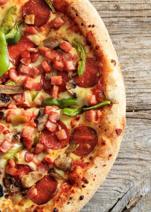 fast-food-concept-half-pizza-top-view-with-crunch-2024-12-07-20-56-19-utc-min